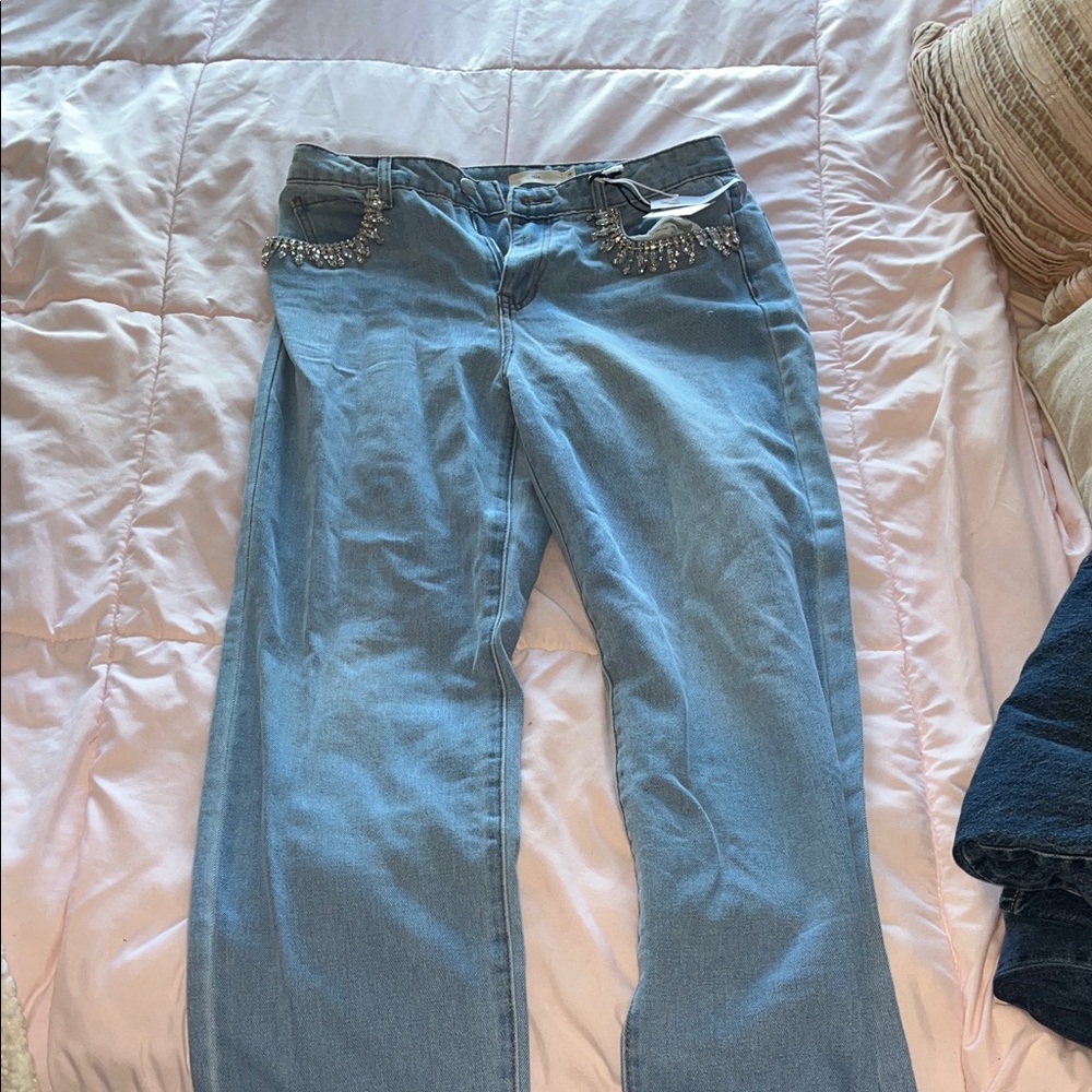 Stylish Light Blue Flare Jeans with Chic Details